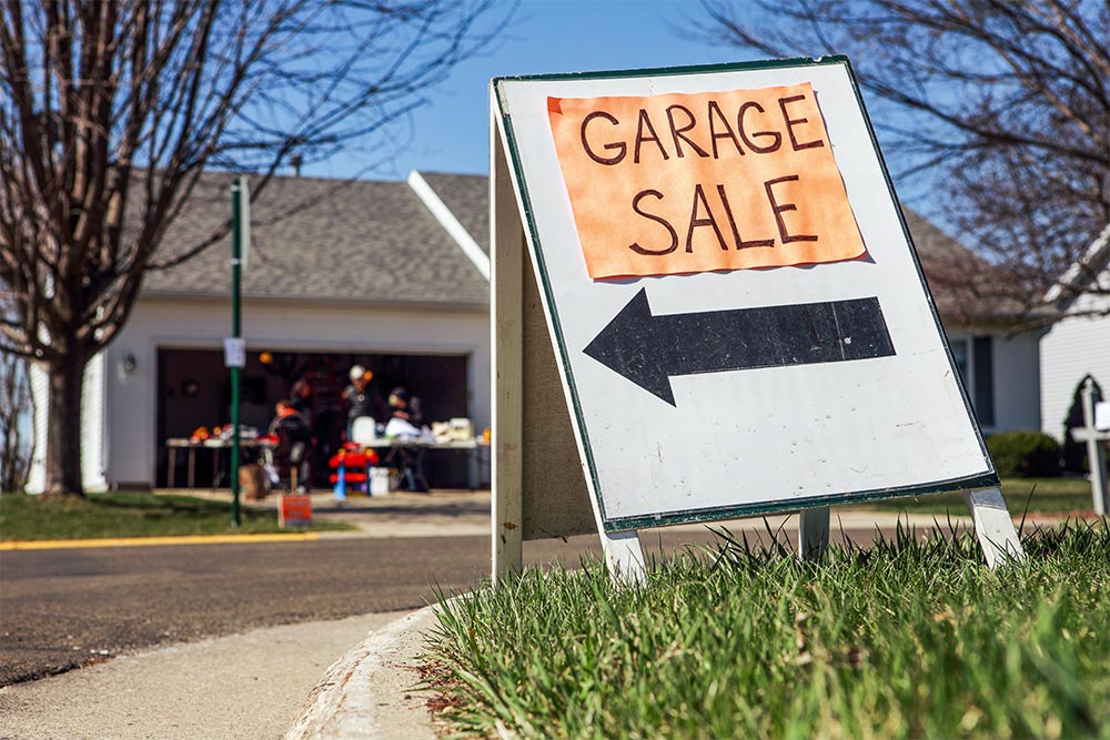 Garage Sale Sign On A Lawn